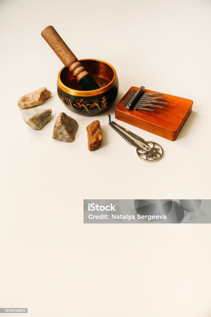 Ethnic shamanic musical instruments, singing bowl, harp and kalimba Music Stock Photo