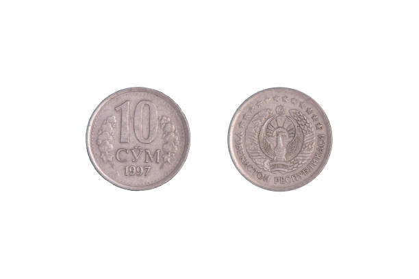 istock 10 Uzbek som coin on a black background. close-up on both sides 1370247551