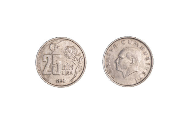 istock Turkish 25 Bin Liras Coins Isolated On black. close-up. 1370248603