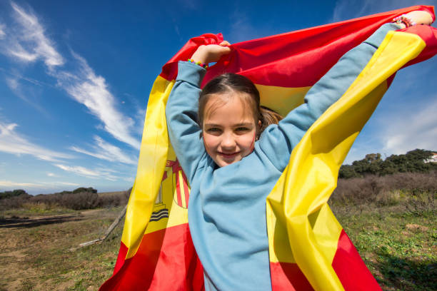 Fan child With Spanish Flag Painted On His Face. Spanish Little Girl With Spain Flag. Fan Of The Olympic Games Fan child With Spanish Flag Painted On His Face. Spanish Little Girl With Spain Flag. Fan Of The Olympic Games hispanic day stock pictures, royalty-free photos & images