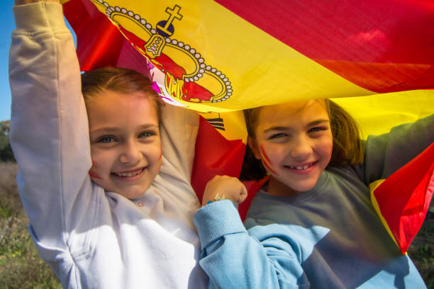 Children Fans With The Flag Of Spain Painted On Their Faces. Little Girls With The Flag Of Spain. Olympics fan Children Fans With The Flag Of Spain Painted On Their Faces. Little Girls With The Flag Of Spain. Olympics fan hispanic day stock pictures, royalty-free photos & images