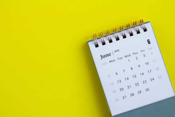 istock Desktop calendar for June 2022 on a yellow background. 1370256389