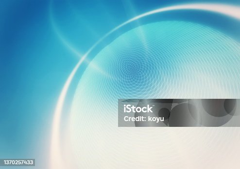 istock Abstract background swirling blue light 1370257433