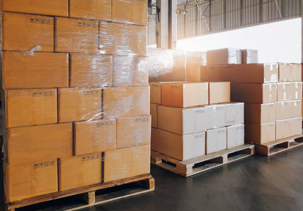 istock Packaging Boxes on Pallets Racks in Storage Warehouse. Supply Chain. Storehouse Shipment Goods. Distribution Warehouse Shipping Logistics. 1370257438