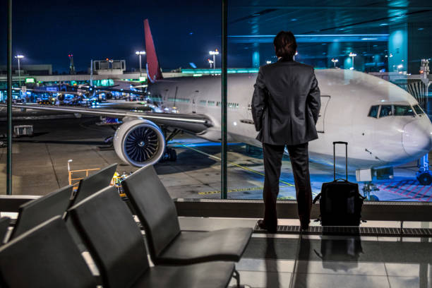 istock Businessman Waiting for Flight in airport terminal 1370258443