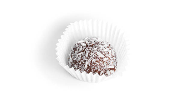 istock Chocolate candy truffle with coconut isolated on a white background 1370258697