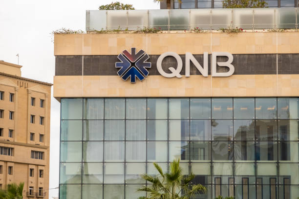 Qatar National Bank logo on the side of a building in Doha, Qatar stock photo