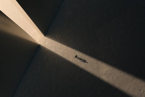istock A scifi man character alone looking at gates of light. Abstract science fiction concept. 3d rendering 1370260810