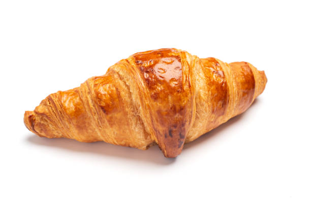 istock Delicious fresh croissant isolated on white background 1370264005