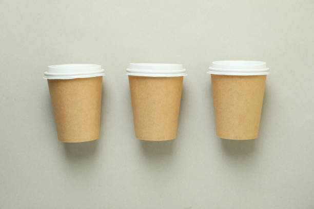 istock Blank paper cups on light gray background 1370265771