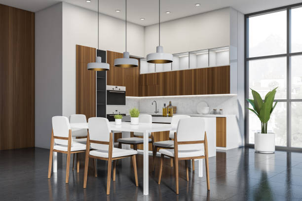 istock White and wooden kitchen set interior with dining table and chairs, window 1370265819