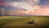 istock Tractor spraying pesticides on soy field  with sprayer at spring 1370265820