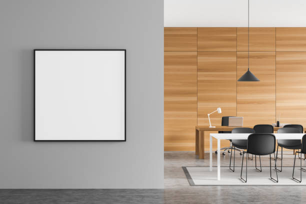 istock Empty square canvas with meeting table in wood and grey office 1370266079