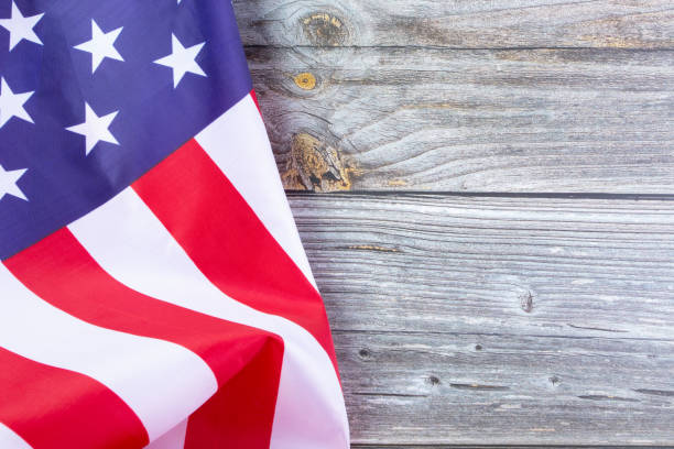 istock American flag on grey wooden table 1370269650
