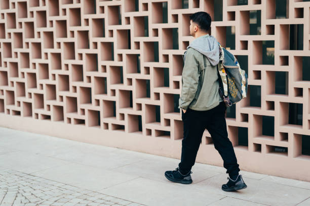 istock Man walking in street 1370269745