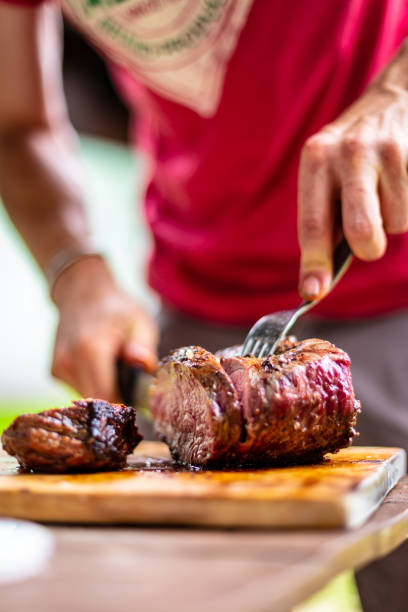 istock barbeque meat preparation in a summer day 1370270475