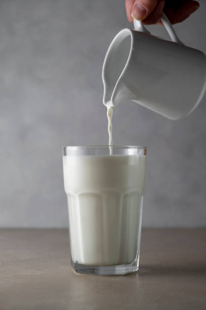 istock Milk poured into glass. Dairy product concept. 1370271186