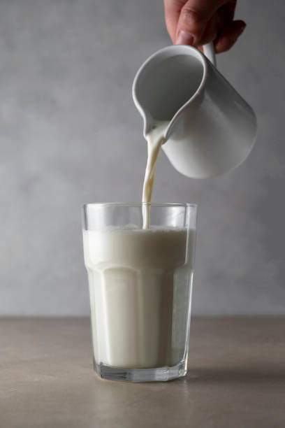 istock Milk poured into glass. Dairy product concept. 1370271198