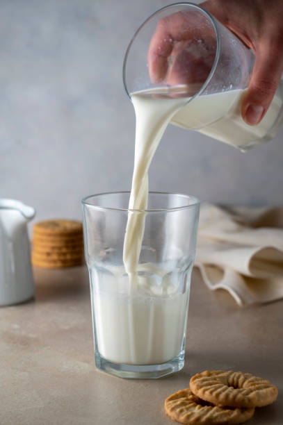 istock Milk poured into glass. Dairy product concept. 1370271204