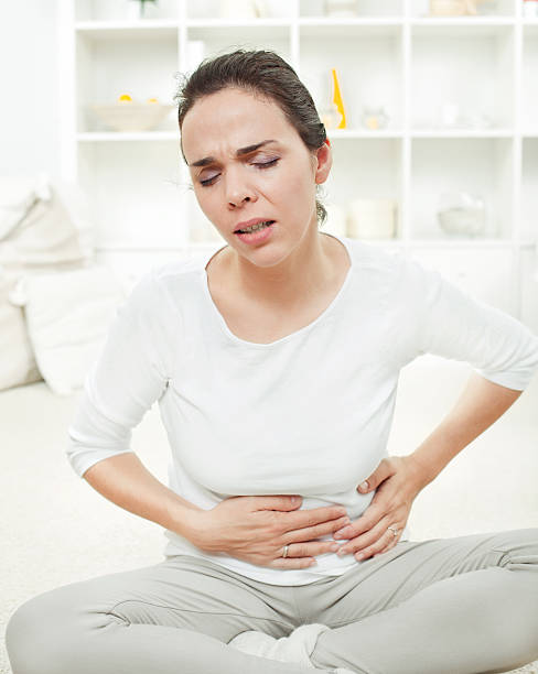 istock Young woman with stomach ache or nausea 137027203