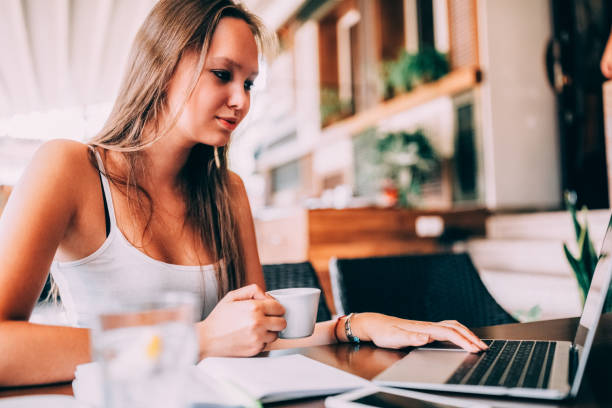 istock Young woman studying in cafe 1370272272