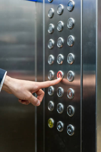 istock Finger pressing on the button on the 6th floor in the elevator 1370273458