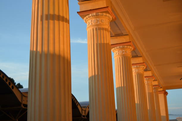 ancient greek columns art at sunset