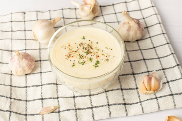 garlic sauce on a white table. Universal garlic sauce.