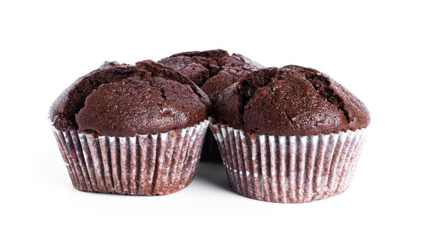 istock Chocolate cupcakes with cherry jam isolated on a white background. Chocolate muffin 1370281049