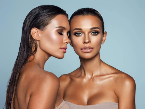 istock Two beautiful emotional women with perfect make-up 1370283349