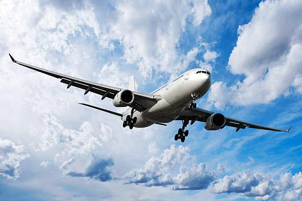 istock jet airplane landing in bright sky 137028405