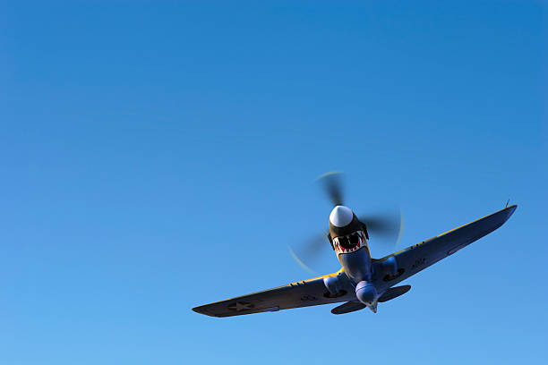 istock propeller fighter airplane flying in clear sky 137028426