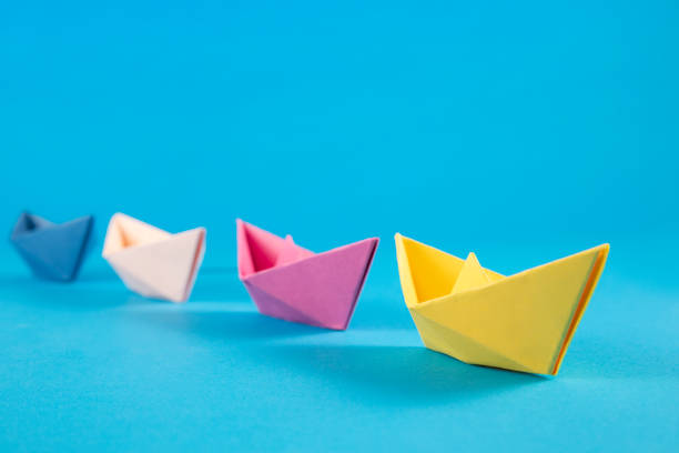 istock Leadership Concept with Paper Boats 1370284556