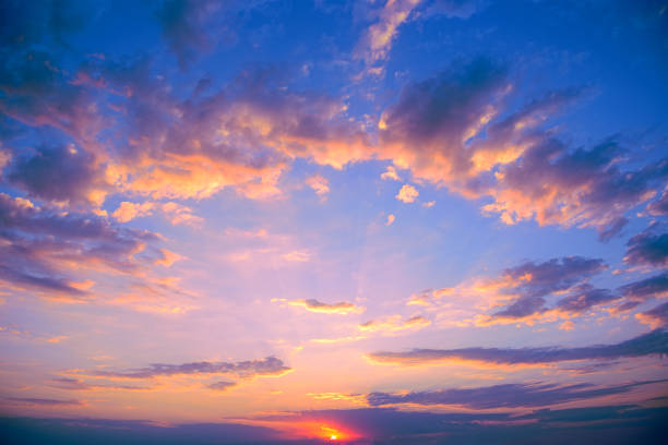 istock Fantastic pink sunset against bright blue sky 1370286263