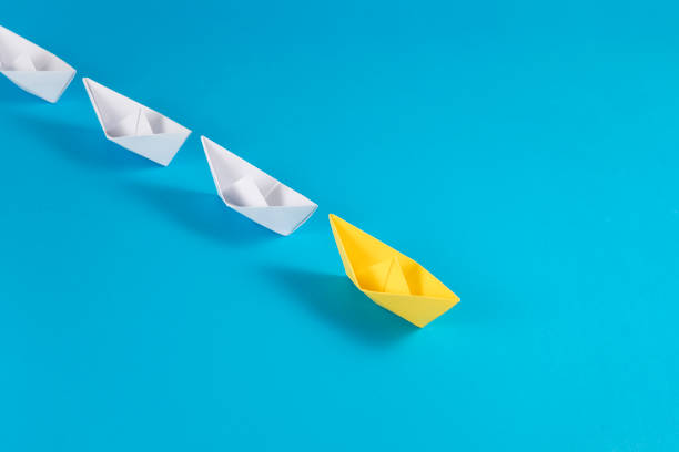 istock Leadership Concept with Paper Boats 1370287178