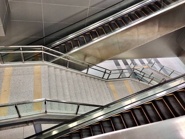 Empty Escalator and Staircase in The Modern Building. A Moving Staircase for Carries People Between Floors of A Building.