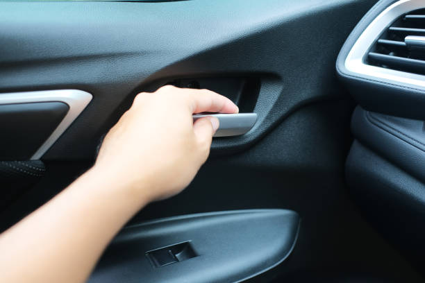 istock Car's passenger hand open the door from inside 1370290538