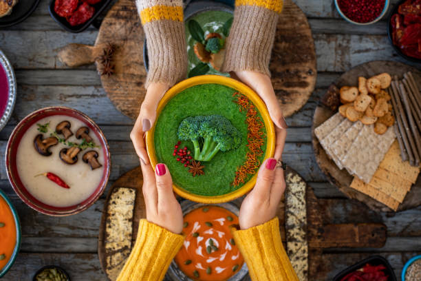 istock Two women drinking their vegetable soups. 1370292428