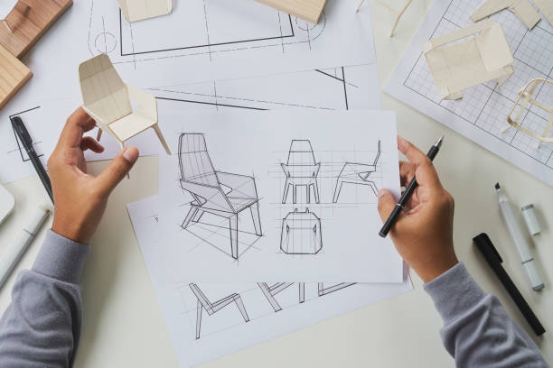 istock Designer sketching drawing design development product plan draft chair armchair Wingback Interior furniture prototype manufacturing production. designer studio concept . 1370292525