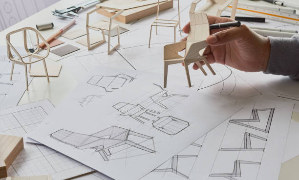 istock Designer sketching drawing design development product plan draft chair armchair Wingback Interior furniture prototype manufacturing production. designer studio concept . 1370292526