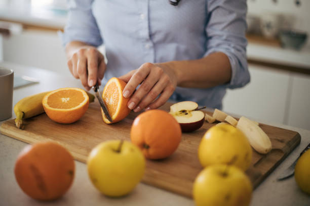 istock Beautiful woman in the kitchen. 1370293866