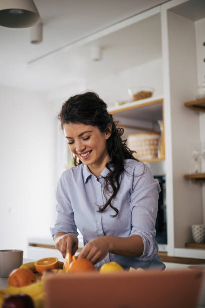 istock Beautiful woman in the kitchen. 1370293967