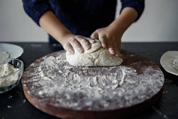 istock An Asian boy cooking with joy in kitchen. 1370294025