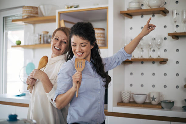 istock Mother and daughter enjoying in the kitchen. 1370294240