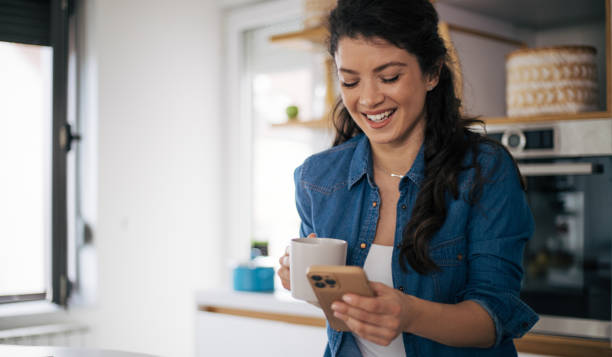istock Beautiful woman in kitchen. 1370295120