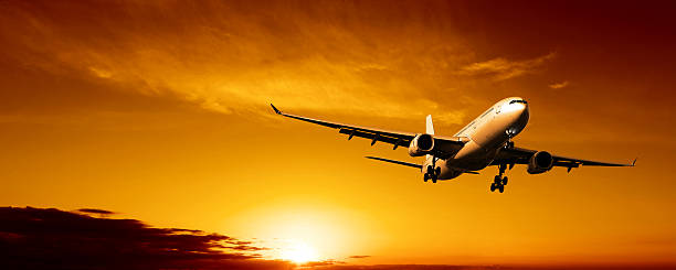 istock XL jet airplane landing at sunset 137029556