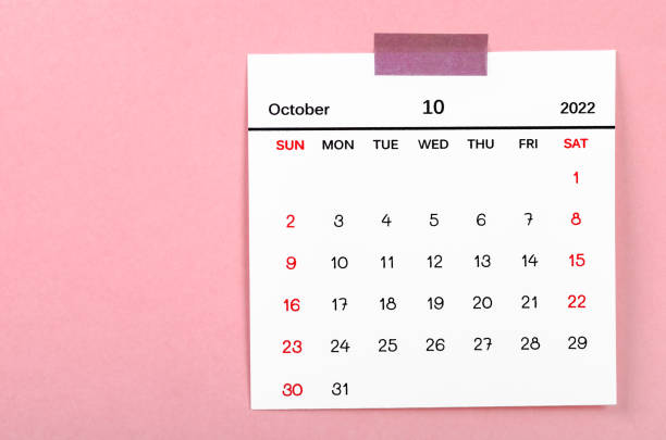 istock October 2022 calendar on pink background. 1370297960