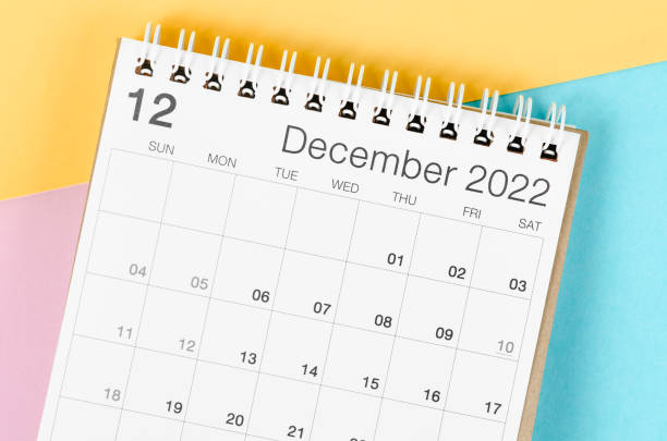istock December 2022 desk calendar on multicolored background. 1370298593