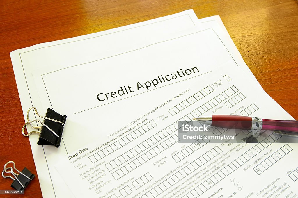 Credit application Blank credit application form with pen and clips Application Form Stock Photo