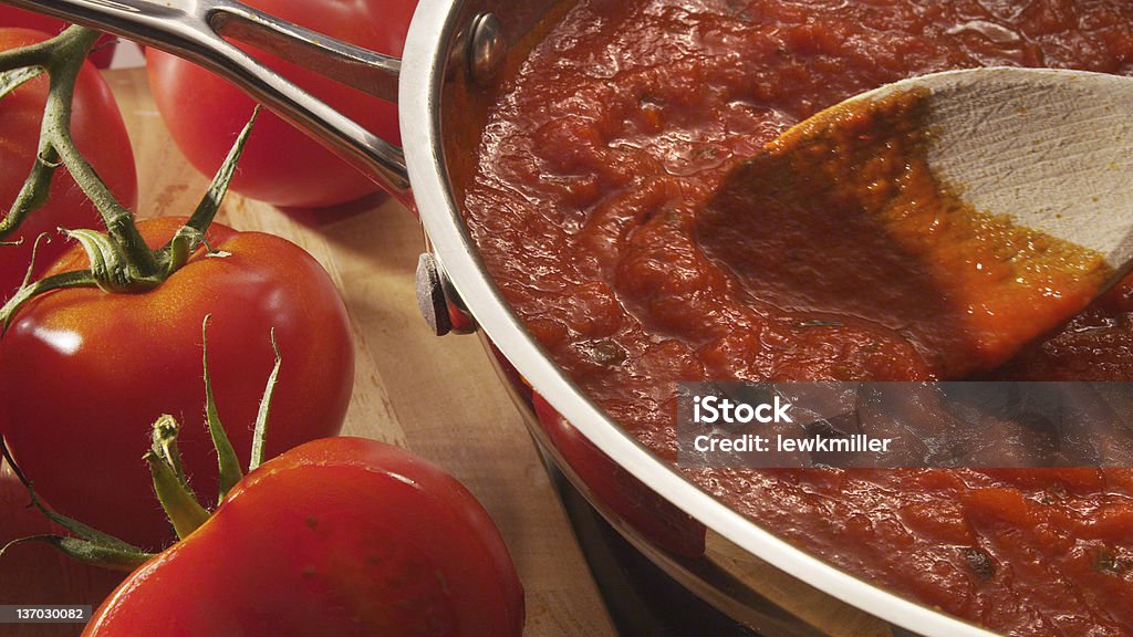 Mariana sauce simmering in pan Tomato Sauce Stock Photo